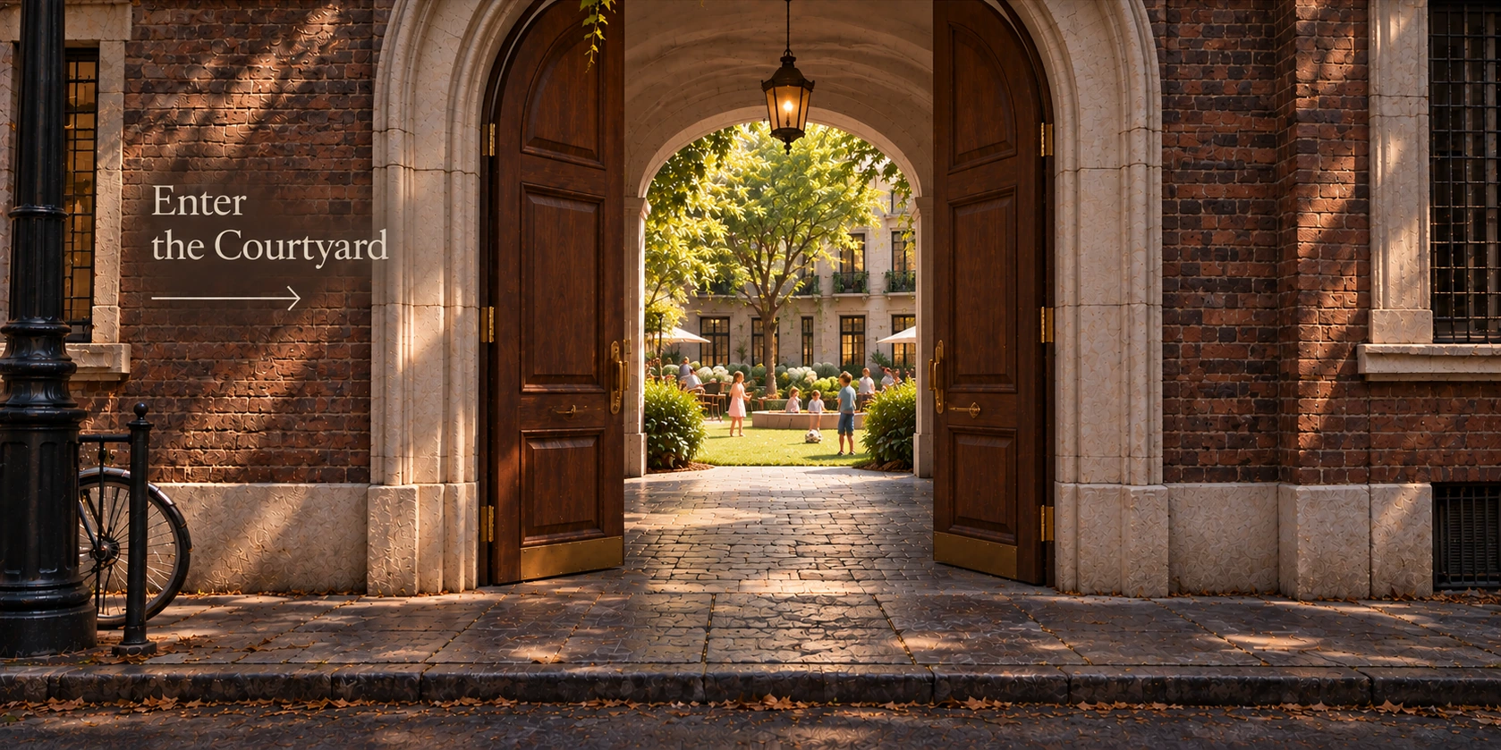 Open timber doors in an urban brick facade lead through a stone-arched passage into a leafy shared courtyard, with mature trees, a winding garden path and neighbors gathering at picnic tables.